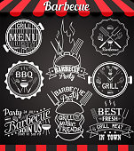 White barbecue party collection of icons, labels, symbols and design elements on blackboard