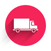 istock White Delivery cargo truck vehicle icon isolated with long shadow. Red circle button. Vector Illustration 1264553049