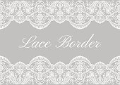 White lace borders on gray background. Template for wedding or greeting card