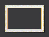 golden and white ornamental vintage style vector frame isolated on dark gray background with copy space for images, paintings, drawings or photos