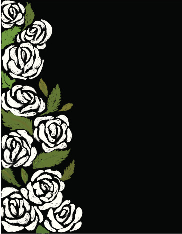 White roses and green leaves on the side of a black backdrop
