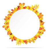 istock White round paper banner surrounded with different autumn leaves. 821651700