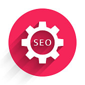 istock White Seo tag with gear wheel icon isolated with long shadow. Red circle button. Vector Illustration 1268545908