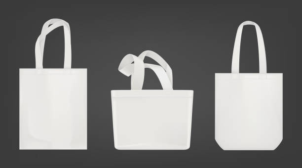 White tote shopping eco bags Tote shopping canvas bags. Vector mockup of realistic white reusable cotton ecobags different shapes isolated on gray background. bag stock illustrations
