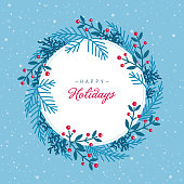 Holiday, Christmas background with greetings, evergreen branches and berries. Flat design, round white frame embraced with blue wreath snowy light blue background. Free space for your text, message, logo.