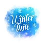 Winter time text vector design for greetings card in blue watercolor style background with snowflakes. Vector illustration.