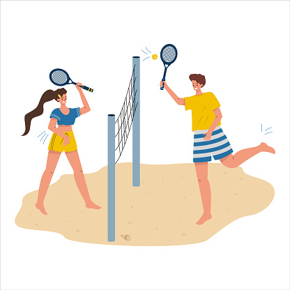 A woman and a man play beach tennis. Summer sports, tennis on the beach