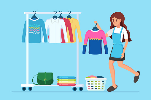 Woman chooses, trying on dress. Girl near wardrobe. Metal rack with clothes, bags on hangers in boutique. Store stand with fashionable outfit. Interior of dressing room. Vector cartoon design
