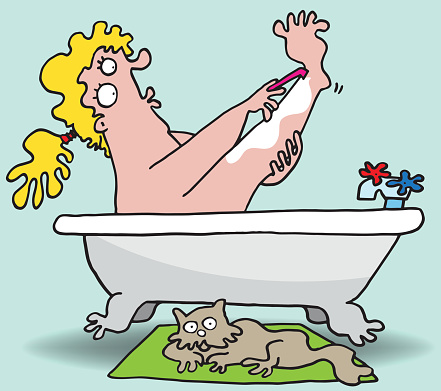 Woman shaving legs in bath