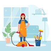 istock Woman with vacuum cleaner in living room. 1322376187