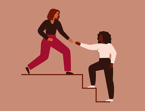 Women support each other. Two females rise up together on the stairs. Woman extends a helping hand to her friend. Woman helps her colleagues to climb career ladder.