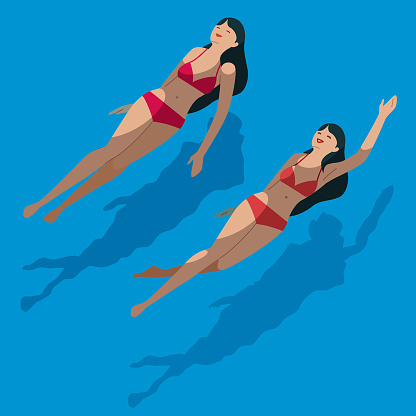 Women swimming on their backs in a pool