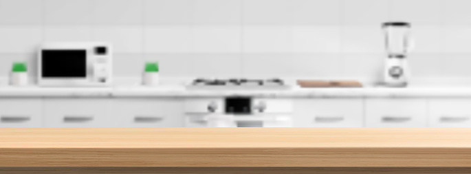 Wooden counter top on kitchen blur background