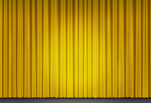 Yellow velvet curtain in theater with spot of light