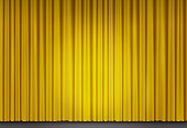 istock Yellow velvet curtain in theater with spot of light 1321451224