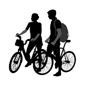 A vector silhouette illustration of a young couple standing on bicycles together.