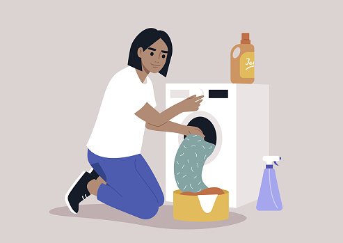 A young female Caucasian character loading a washing machine with a pile of laundry, domestic chores