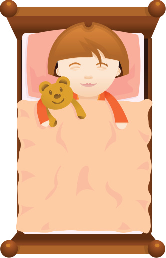 Young girl asleep in bed with a teddy bear
