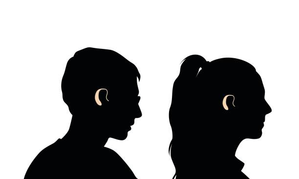 Young Hearing Problems Silhouette drawing of a man and a woman wearing hearing aids hearing aids stock illustrations