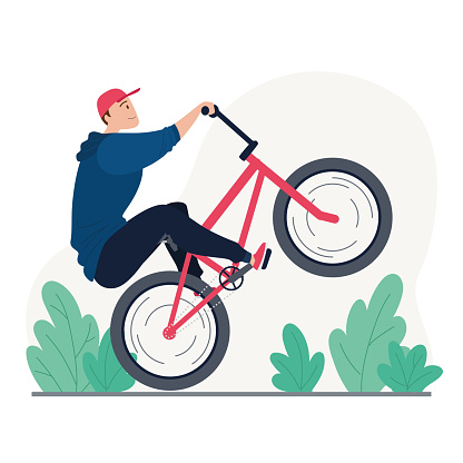 Young man riding a bmx bike