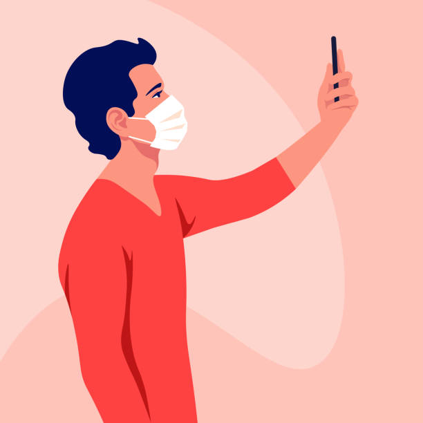 illustrations, cliparts, dessins animés et icônes de un jeune homme porte un masque médical prend un selfie et tient un smartphone dans sa main. coronavirus. un blogueur. épidémie et pandémie. - selfie