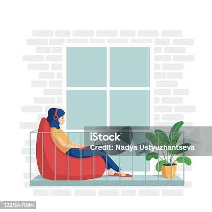 istock A young woman in home clothes is sitting in a bag with a laptop on the balcony. The concept of remote work from home, distance learning, programming, freelancer. Vector illustration in a flat style. 1221547084