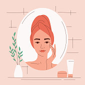 A young woman in the bathroom looks in the mirror and cares for her face with cream. Daily skin hydration. Anti-aging procedure. Clean healthy skin. Vector illustration square composition