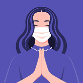 A young woman wears medical mask prays to god. Portrait of a girl with closed eyes in the temple. Coronavirus. Vector flat illustration