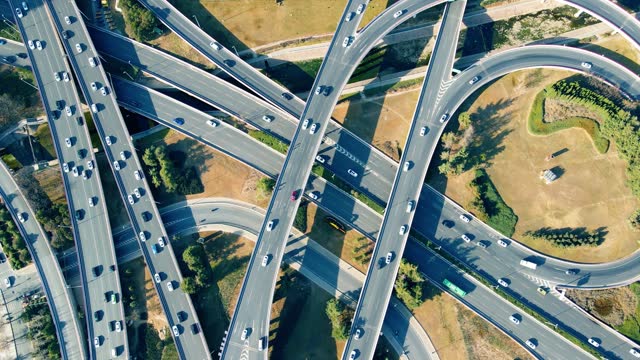 Aerial view of car driving on city overpass