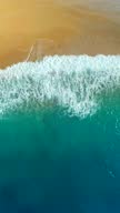 istock Aerial view of clear turquoise sea and waves 1307900361