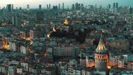 istock Aerial View of Galata Tower and Skyscrapers Istanbul at Night - 4K Drone Footage 1297217083