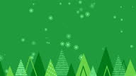 istock Animation of christmas trees and snowflakes falling on green background 1285000809