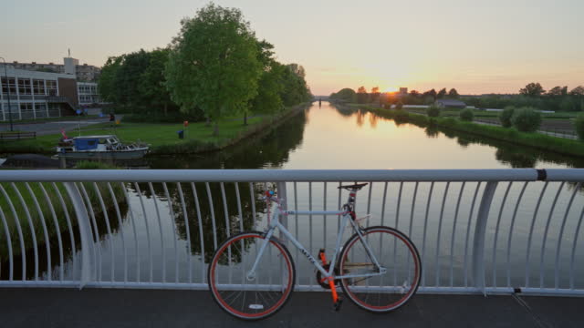 Bicycle on the bridge over the canal in Netherlands