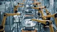 istock Car Factory 3D Concept: Automated Robot Arm Assembly Line Manufacturing High-Tech Green Energy Electric Vehicles. Automatic Construction, Welding Industrial Production Conveyor. Front View Time-Lapse 1335870805