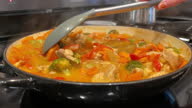 istock Chicken Curry with Vegetables Meal on Electric Range Stovetop Slow Motion Video Series 1343689062