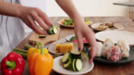 istock Close up of a young woman preparing food 1152245037