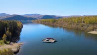 istock Crossing the wide Yenisei River. river transport. pantone ferry. Filming from a drone. 1294195397