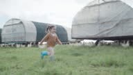 istock Cute little girl running into her mother's arms on their chicken farm. Rural family caring for livestock while raising free range animals for egg and poultry industry. Sustainable, organic agriculture 1408401965