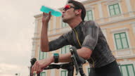 istock Cyclists drink energy drinks 1331139142
