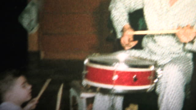 (8mm Vintage) 1965 Dad and Son Playing Drums Together Christmas Morning