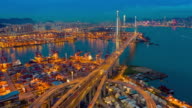 istock Day to Night Aerial view hyperlapse or timelapse of Hong Kong Kwai Tsing Container Terminals and Stonecutters bridge at dusk 1154734881