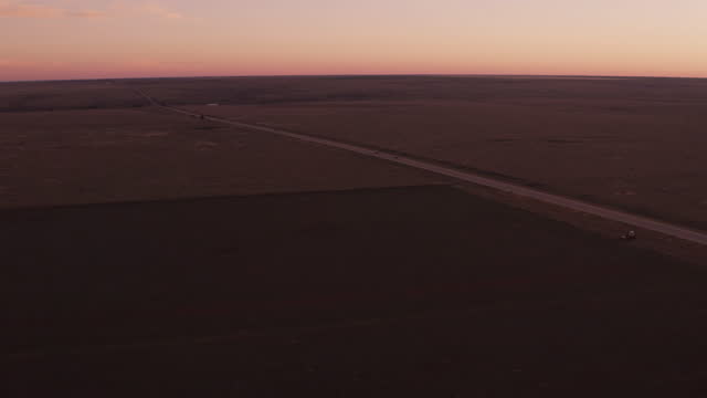Desert road at sunset