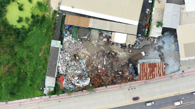 Drone point of view time lapse of recycle junk yard
