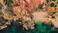 istock Drone shot of rocky cliff and sea, Lagos, Algarve, Portugal 1315032539