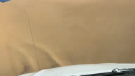 istock Dune driving in desert. White SUV car off road travel in Africa 1374786740