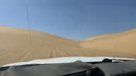 istock Dune driving in desert. White SUV car off road travel in Africa 1374786767