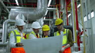istock Engineerc and Foreman are discussing the plant layout on the blueprint in the factory boiler room 1314489975