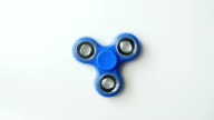 istock Fidget spinner isolated over white, top view 820865408
