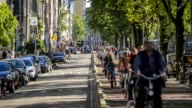 istock Five o'clock rush hour in Amsterdam, Gelderse kade. Commuters on bicycles riding back home after a work 869367612