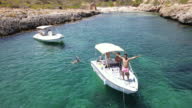 istock Friends enjoying holidays at a motor boat 1393589430